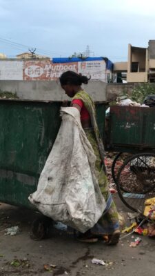 Suvartha holding a bag